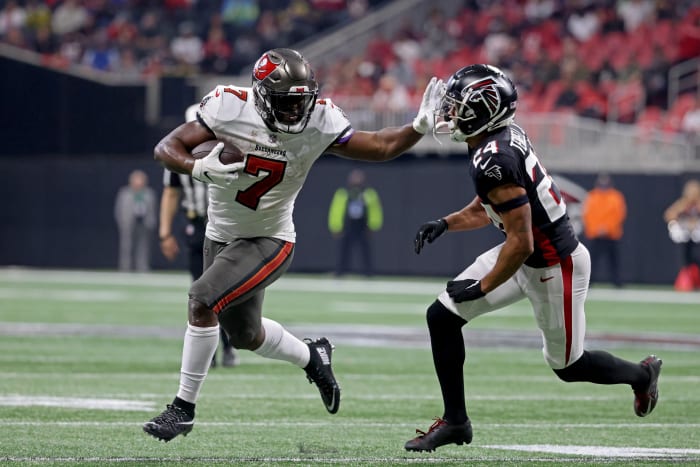 Tampa Bay Buccaneers running back Leonard Fournette (7) runs through Atlanta Falcons cornerback A.J. Terrell (24). Mandatory Credit: Jason Getz-USA TODAY Sports